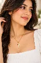 Elegant Gold Cross Necklace Portrait.webp
