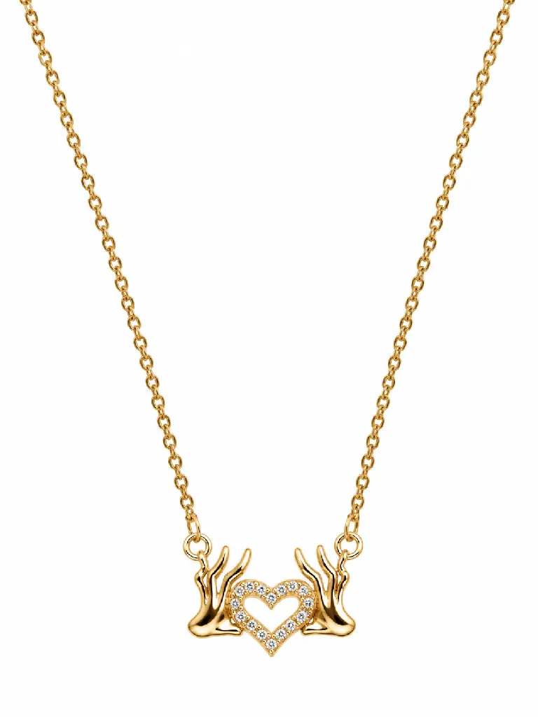 Gold Hands Framing a Gemstone Heart Necklace.webp