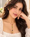 Elegant Portrait with Colourful Pendant.webp